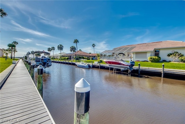 dock area featuring a residential view and a water view