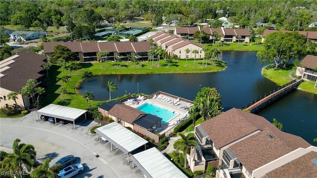 bird's eye view with a water view and a residential view