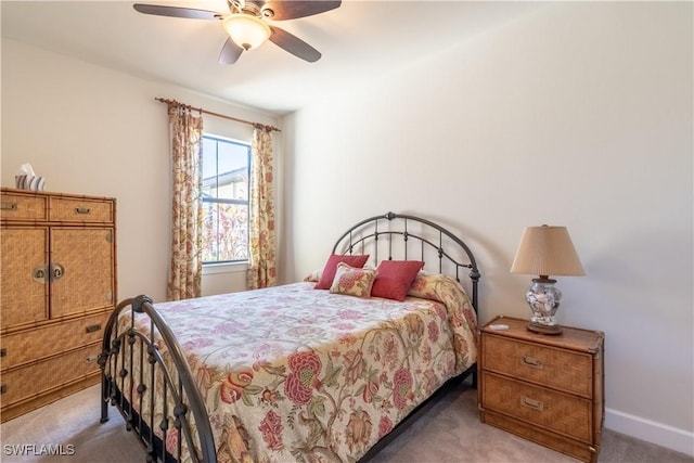 bedroom featuring carpet, baseboards, and a ceiling fan