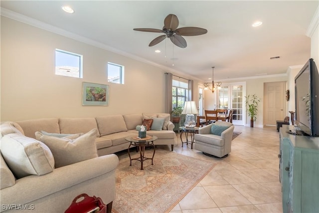 living area with light tile patterned floors, ornamental molding, visible vents, and recessed lighting