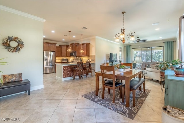 dining area featuring light tile patterned floors, recessed lighting, visible vents, baseboards, and crown molding