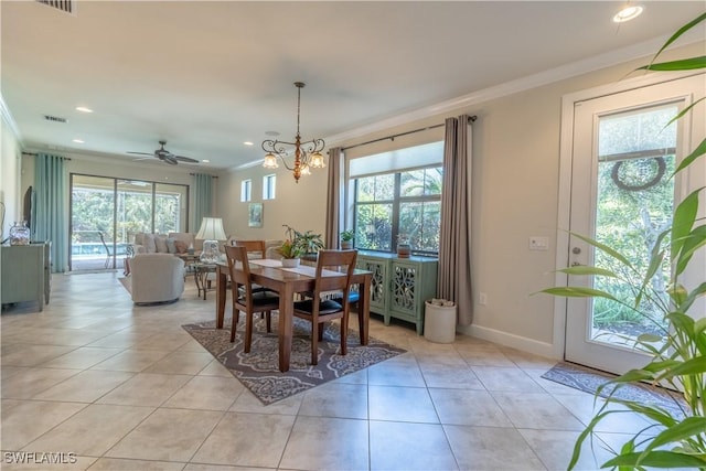 dining space with light tile patterned flooring and crown molding