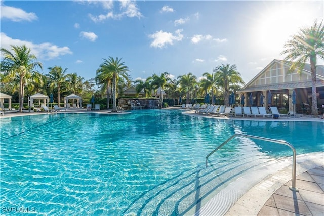 community pool with a patio and a gazebo