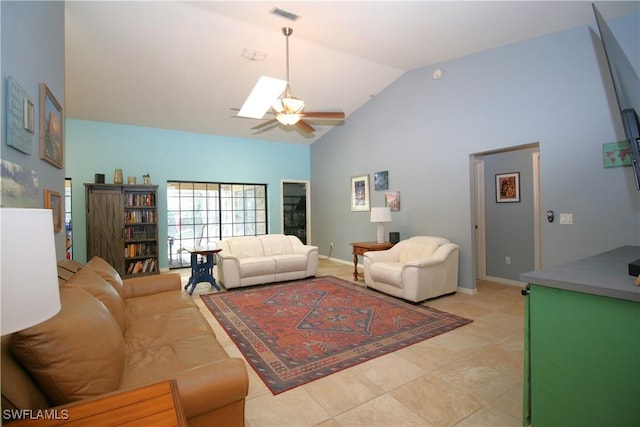 living room with baseboards, a skylight, visible vents, high vaulted ceiling, and a ceiling fan