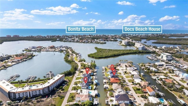 birds eye view of property with a water view