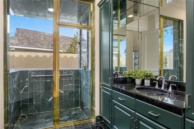 bathroom featuring a shower stall and vanity