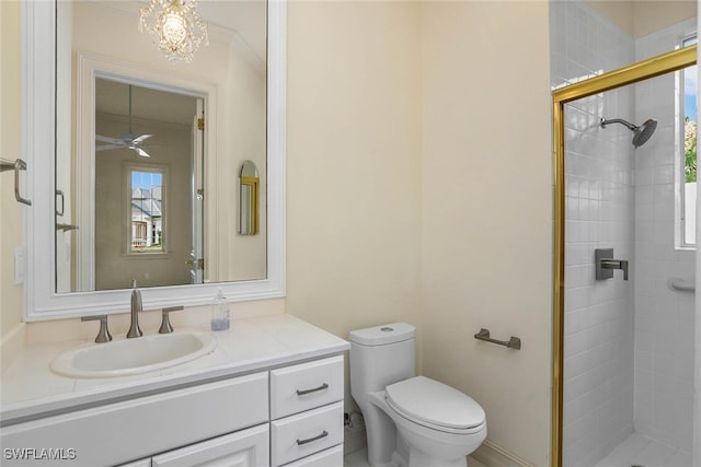 bathroom featuring toilet, a stall shower, and vanity