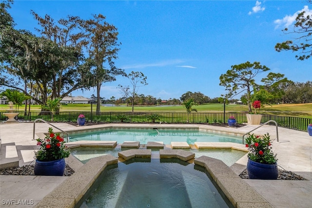 view of swimming pool with a patio area, a fenced backyard, and a pool with connected hot tub