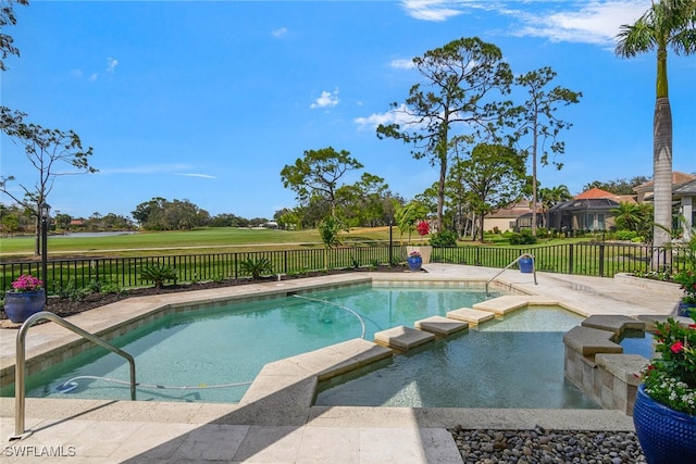 view of swimming pool featuring a pool with connected hot tub, a fenced backyard, and a patio