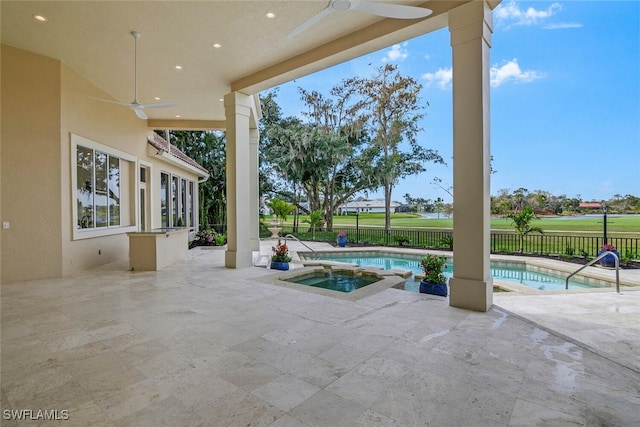 view of patio featuring ceiling fan, an in ground hot tub, a fenced backyard, and a fenced in pool