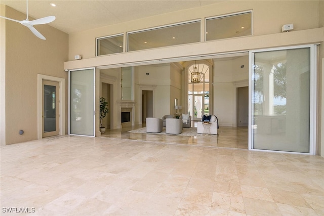 interior space with a patio area and ceiling fan