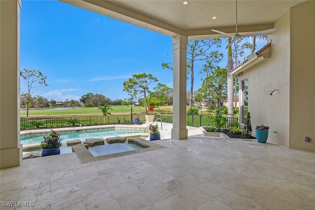 view of patio / terrace featuring a fenced backyard, a ceiling fan, and a fenced in pool