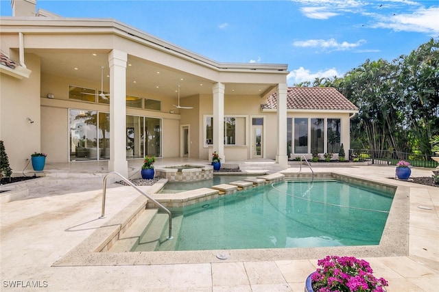 view of swimming pool with a fenced in pool, a patio area, fence, and an in ground hot tub