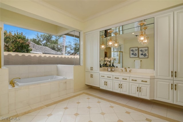 bathroom featuring tiled bath, baseboards, tile patterned floors, crown molding, and vanity