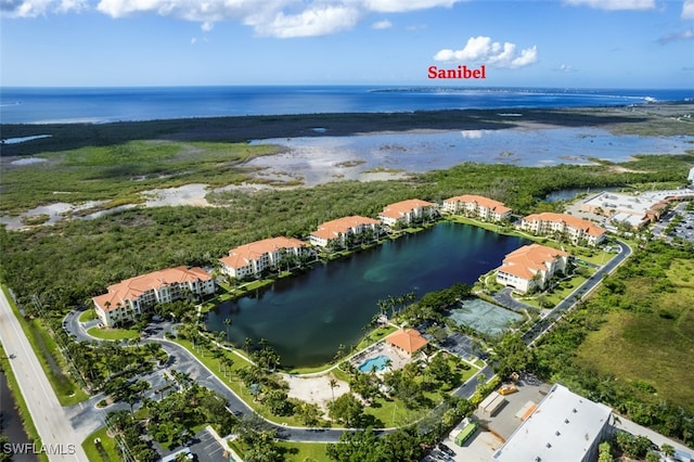 drone / aerial view featuring a residential view and a water view