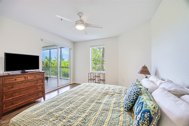 bedroom with access to exterior, ceiling fan, and wood finished floors