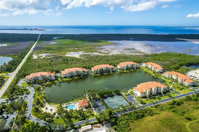 birds eye view of property featuring a water view and a residential view