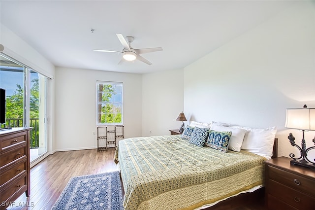 bedroom featuring access to outside, ceiling fan, light wood-style flooring, and baseboards