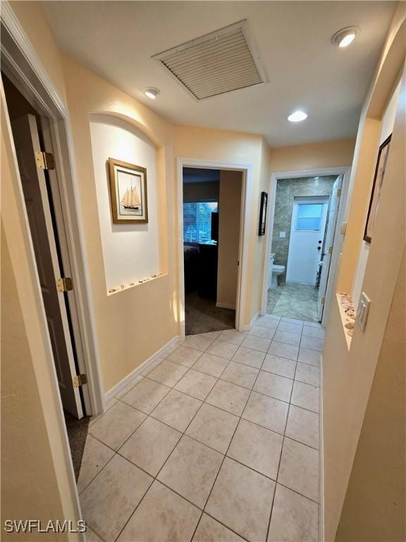 142 SE 30th Ter, Cape Coral, FL 33904 - corridor with light tile patterned floors, recessed lighting, and baseboards