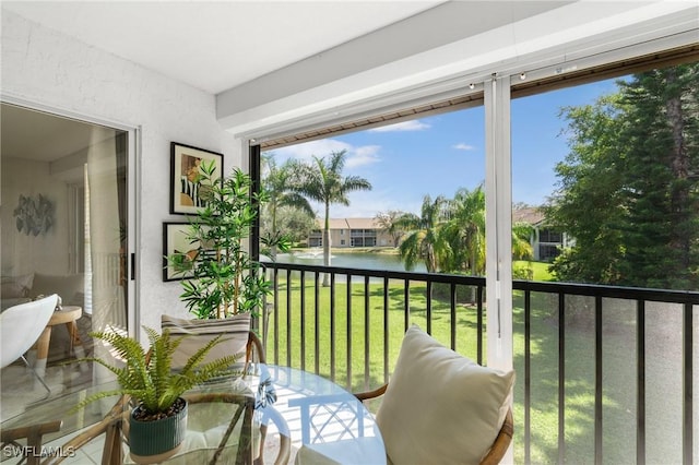 balcony featuring a water view