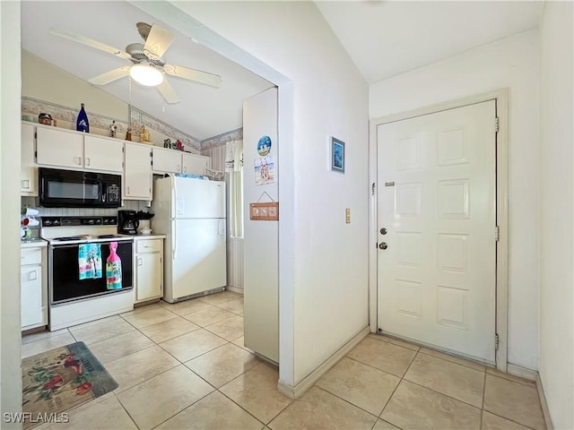 kitchen with lofted ceiling, white appliances, ceiling fan, white cabinets, and light tile patterned flooring