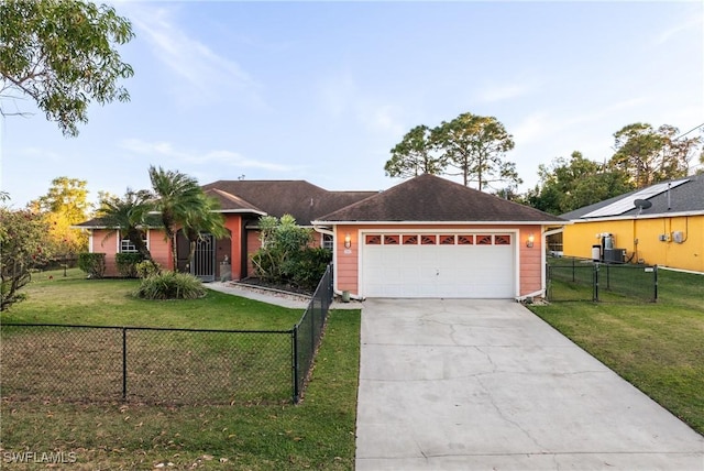 ranch-style house featuring a front lawn and a garage