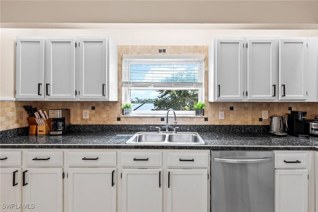 kitchen with decorative backsplash, white cabinets, dishwasher, and a sink