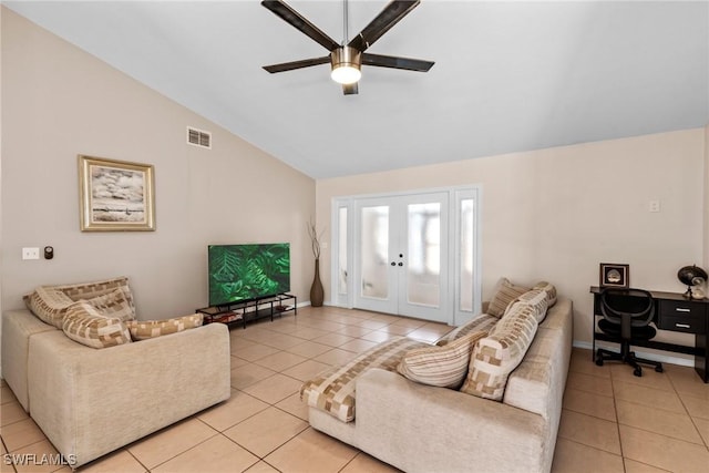 living area with lofted ceiling, french doors, light tile patterned floors, and visible vents