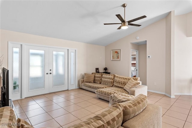 living area with baseboards, ceiling fan, vaulted ceiling, french doors, and light tile patterned flooring