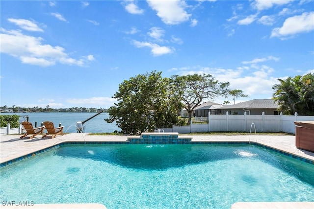 view of pool with a patio area, a water view, fence, and a fenced in pool