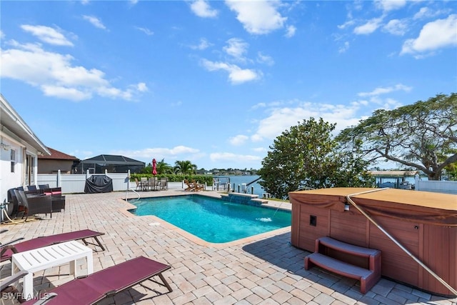 view of swimming pool with a fenced in pool, fence, a hot tub, and a patio