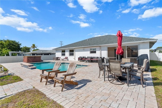 view of pool featuring a patio, a fenced backyard, an outdoor hangout area, a fenced in pool, and a hot tub