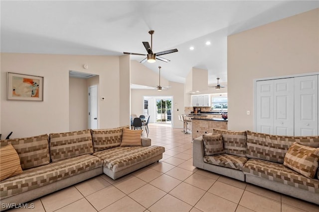 living room with light tile patterned floors, ceiling fan, high vaulted ceiling, and recessed lighting