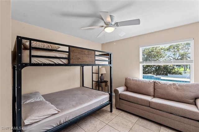 bedroom with ceiling fan and light tile patterned floors