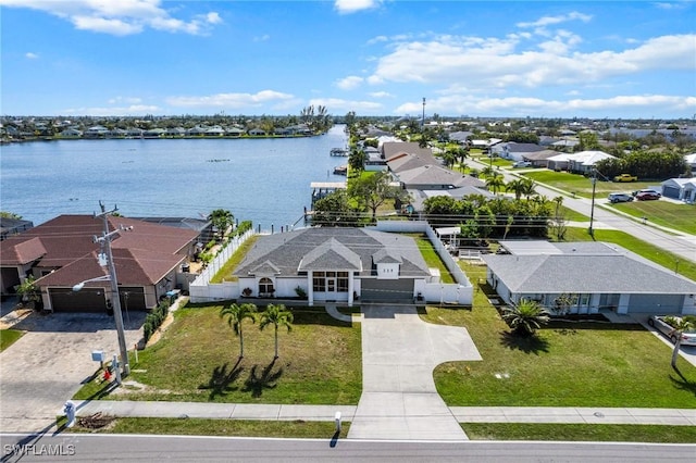 birds eye view of property featuring a water view and a residential view