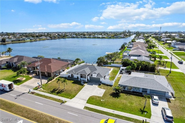 aerial view with a residential view and a water view