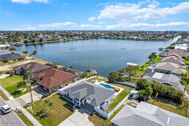 drone / aerial view featuring a water view and a residential view