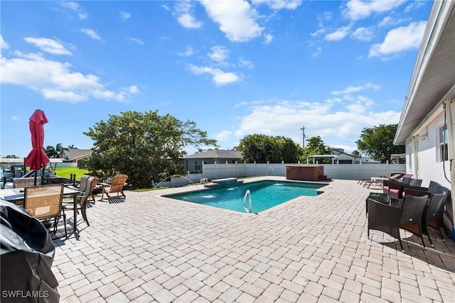 view of pool with a hot tub, a fenced in pool, a patio, a fenced backyard, and grilling area