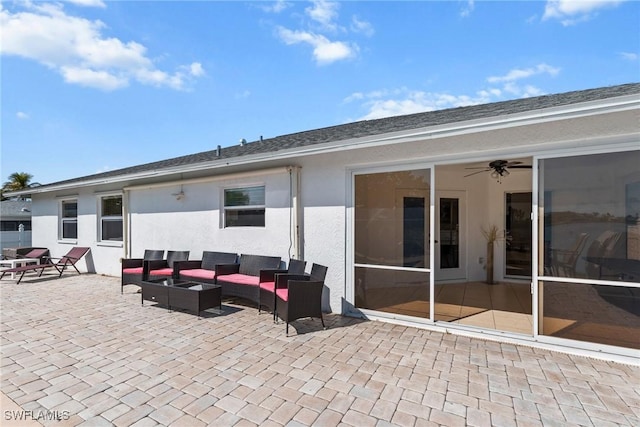 view of patio with outdoor lounge area and a ceiling fan