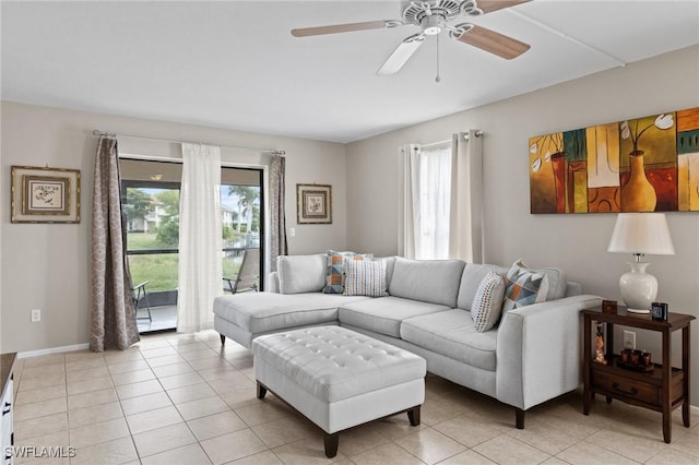 living room featuring ceiling fan and light tile patterned floors