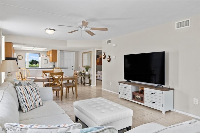 tiled living room with ceiling fan