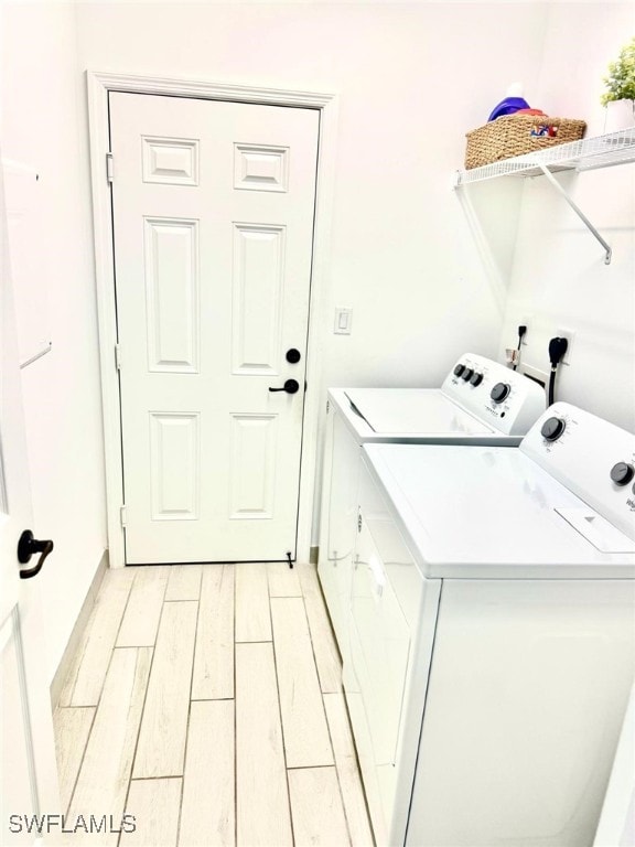 laundry room with washing machine and dryer