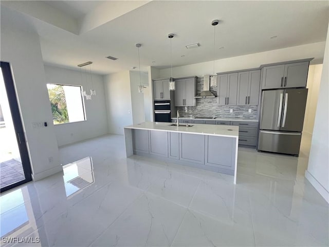 kitchen with marble finish floor, gray cabinets, light countertops, wall chimney range hood, and black appliances