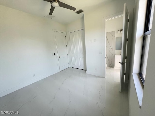 unfurnished bedroom featuring baseboards, visible vents, ceiling fan, marble finish floor, and a closet