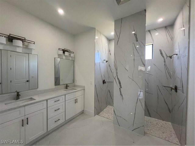 full bath featuring marble finish floor, a sink, and a marble finish shower