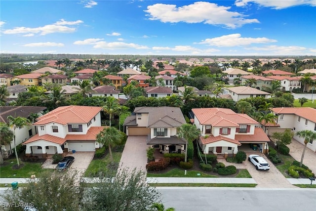 birds eye view of property with a residential view