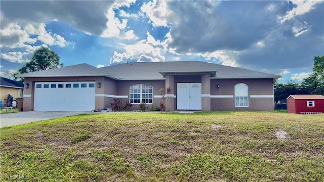 view of front facade featuring a front lawn and a garage