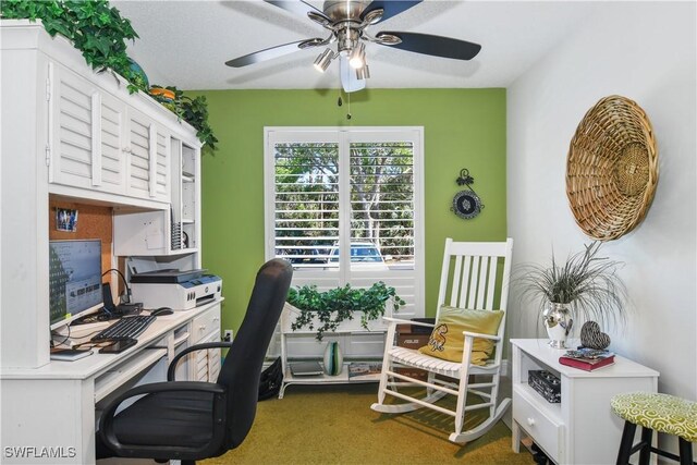 carpeted office with ceiling fan