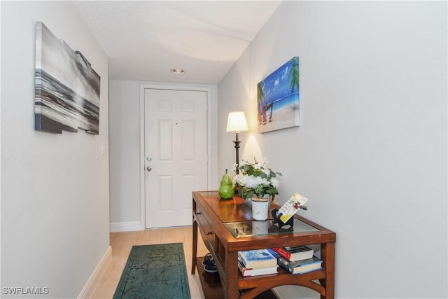 entryway featuring baseboards