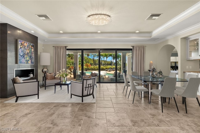 dining room with visible vents, crown molding, and a tray ceiling